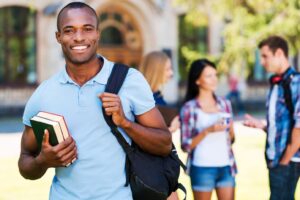 student holding books