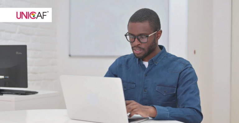 man with laptop sitting on the office